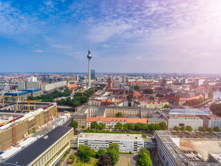 Fototapeta premium Aerial view of Berlin cityscape from drone in summer season with city landmarks and blue sky, Germany