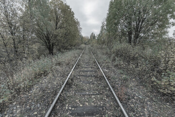 Old railway line at autumn day.
