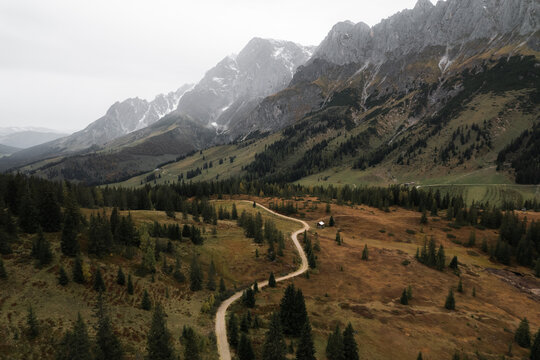 Narrow road among mountains and forest