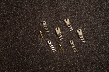 several transistors on a gray background