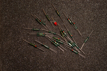 multi-colored mechanical diodes on a gray background