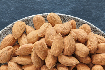 Close up of almonds on a plate, selective focus.