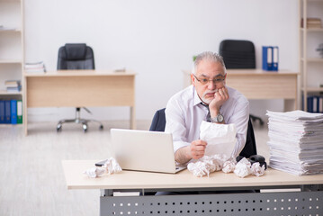 Old male employee in brainstorming concept