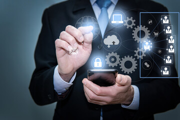 Businessman using modern computer, pressing button on virtual screen. Icons cloud technology and networking concept. Connecting to world wide network