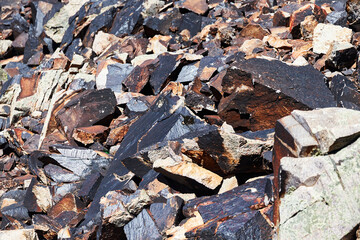 crumbling rocks and boulders fallen off the cliff
