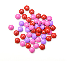 sugar coated pills on white background