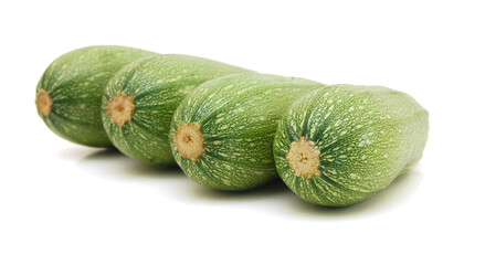 Three fresh green zucchini isolated on white background 
