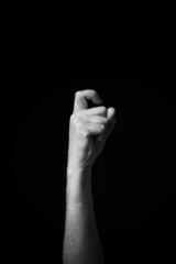 B+W image of hand demonstrating Chinese sign language letter J isolated against black background