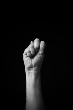 B+W image of hand demonstrating Chinese sign language letter N isolated against black background