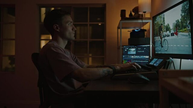 Professional color grading specialist edit raw ungraded files on computer. Editing and grading pro work from home on freelance basis. Late night editing of important project