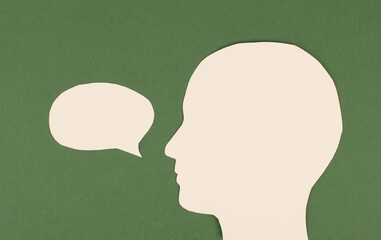 Silhouette of a face, speech bubble in white color, copy space for text, communication, having an opinion, free speech
