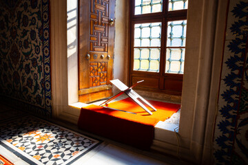 Islamic background photo. Lectern on the window of mosque.
