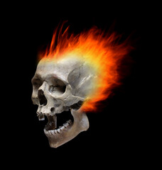 The skull is on fire on a black background.