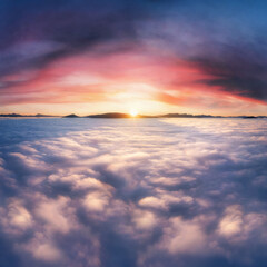 Fototapeta na wymiar Thick clouds in the mountains at dawn. Beautiful aerial landscape with thick fog against dramatic sunset sky.