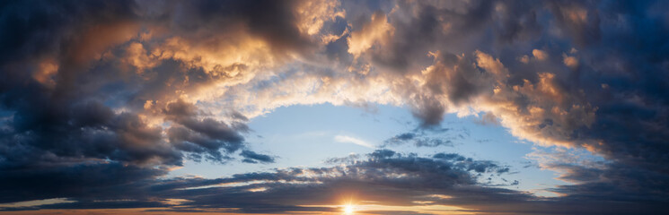 Fototapeta na wymiar Beautiful panorama of cloudy sunset sky.