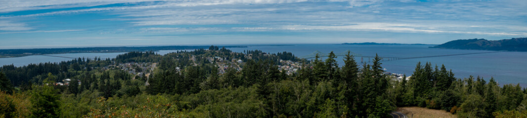 Fototapeta na wymiar A panoramic view of the city of Astoria, Columbia River and the Columbia River Bridge that reaches 4.2 miles from Astoria to meagle in Washington