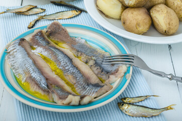 Herring and potato in plate