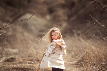 girl model in a beige raincoat