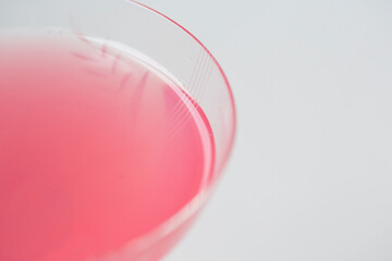 selective focus,  pink cocktail from lingonberries with bubbles background, cold fresh lemonade drink closeup, macro