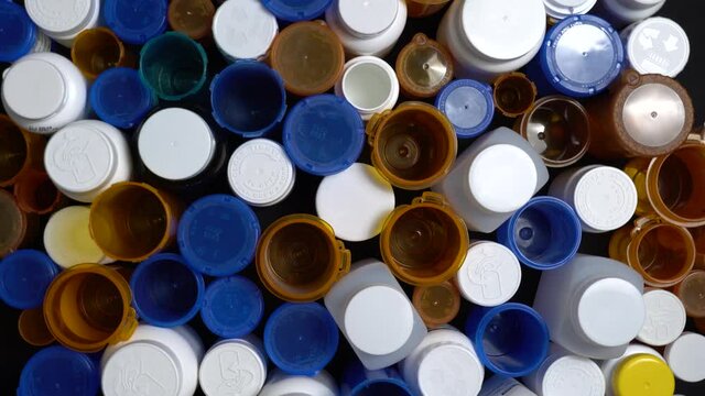 Medical waste. Empty pills bottles or packs for medications. Disposing empty medication containers made of plastic. Hospital waste. Pharmaceutical industry. Overbooked hospitals treatments.