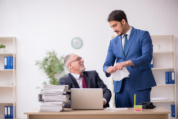 Two male employees in dismissal concept