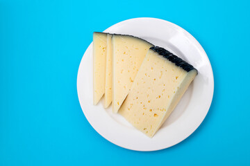 slices cheese on white small plate