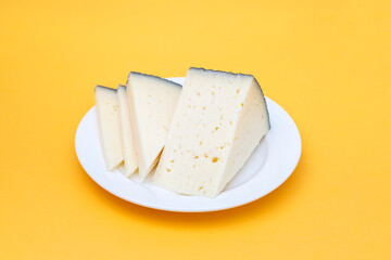 slices cheese on white small plate