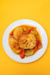 typical portuguese fish stew on white plate