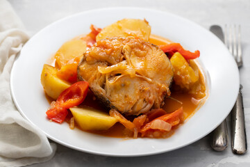 typical portuguese fish stew on white plate
