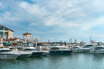 Fototapeta na wymiar luxury private yachts moored at the pier of the seaport of Sochi, Russia