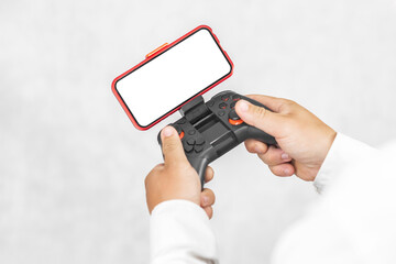 Joystick with a smartphone mockup in the hands of a guy. On a light background.