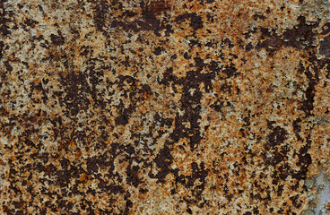 Rust on metal, with shades of orange and blue 