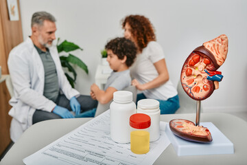 Doctor urologist consultation for male child. Collecting urine to tests for treatment of children...