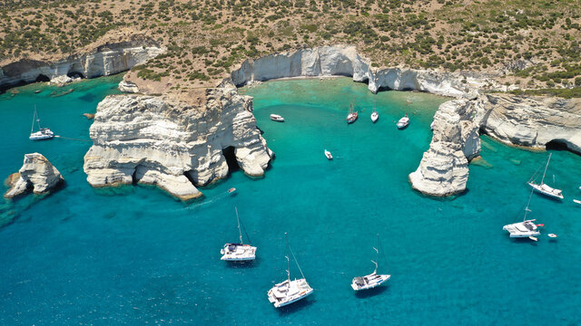 Aerial drone photo of Kleftiko a beautiful scenic white volcanic rock formation bay visited by sail boats and yachts with turquoise crystal clear sea and caves, Sea Meteora of Greece, Milos island