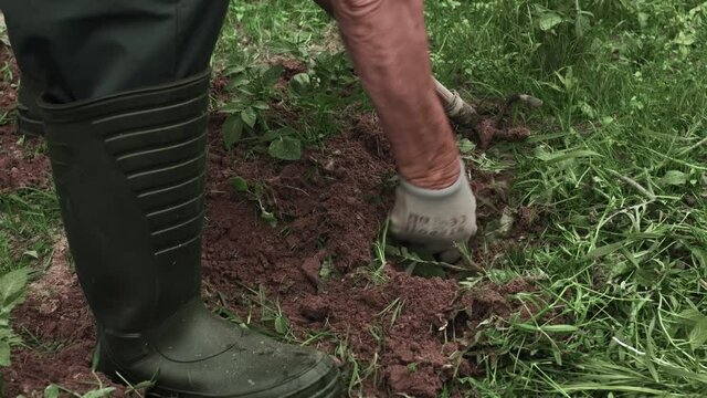 A man at work on the plot.