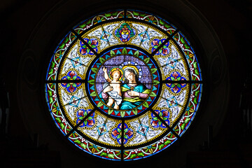The famsous Cathedral of Saint Lawrence in Lugano and its stained glass rosette of Virgin Mary with...