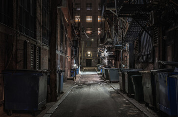 Fototapeta na wymiar Dark abandoned alley at night