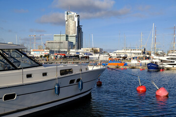 Yacht port in Gdynia, Poland. Yacht by red buoys.