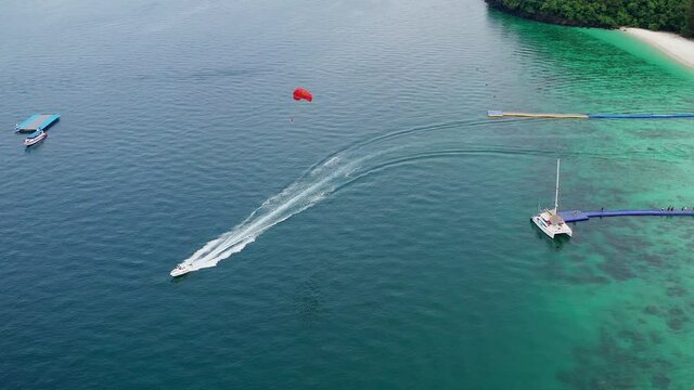 Coral island, koh He, beach and boats in Phuket province, Thailand