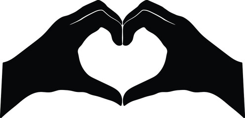 Fototapeta premium Silhouette of hand made heart symbol