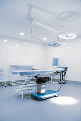 Empty interior operating room and modern equipment in hospital. Medical device for surgeon surgical emergency patient in blue tone style. Save life medical treatment concept