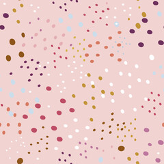 Abstract seamless pattern with dots on a pink background.