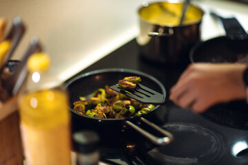 Brussels sprouts fried on a pan