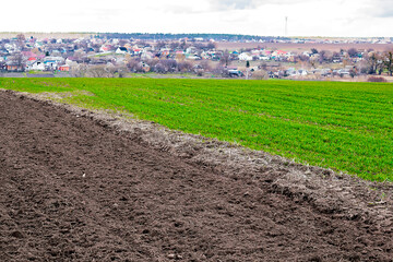 Plowed agricultural field ready for seed sowing, planting process. Newly ploughed field with...
