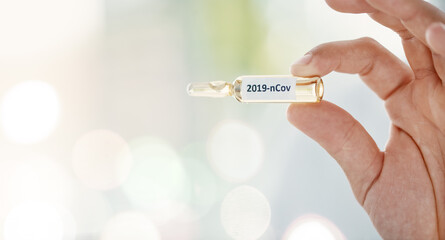 And the cure goes viral. Cropped shot of a scientist holding an ampoule with 2019-nCov on it.