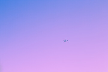 Clear blue and pink  morning sky with copy space.  Resort beach. Helicopter rescue flight in tropical country.