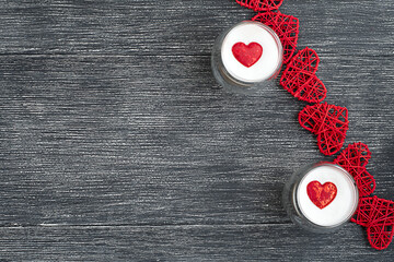 two cups of coffee with a red heart on a black and white background
