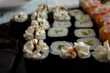 sushi with fish and vegetables. baked sushi. delicious food with delivery.