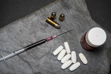 syringe and pills