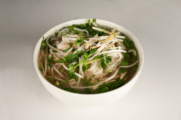 Vietnamese  Pho Soup  in a bowl  on a plain white background